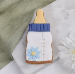 Ciastko lukrowane BUTELKA dziecięca na mleko z kwiatkiem