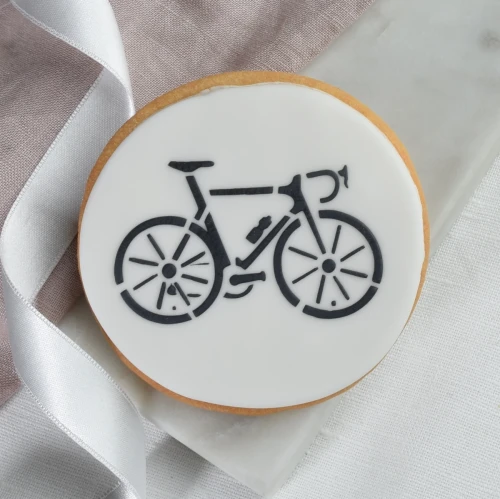 Okrągłe ciasteczko z rysunkiem roweru.