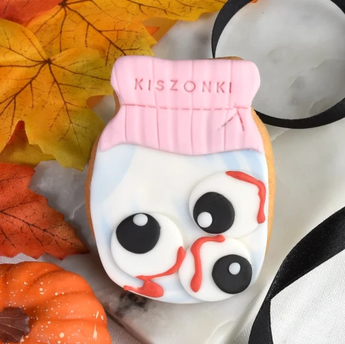 Ciasteczko na Halloween w kształcie słoika pełnego gałek ocznych.