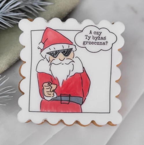 Ciasteczko z autorską grafiką przedstawiającą Świętego Mikołaja.